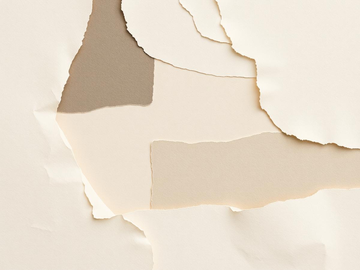 Layered torn paper collage in beige tones